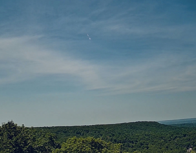 A meteor in a blue sky